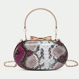 Elegant Snakeskin Patterned Handbag with Gold Accents
